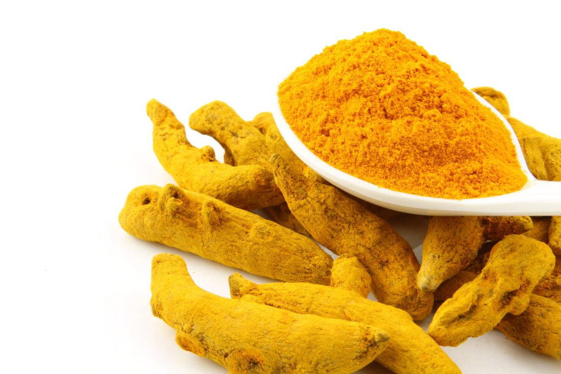 Yellow Turmeric Powder And Rhizomes Wallpaper