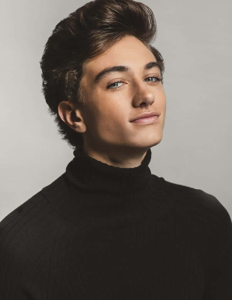 Young Actorin Black Turtleneck Wallpaper