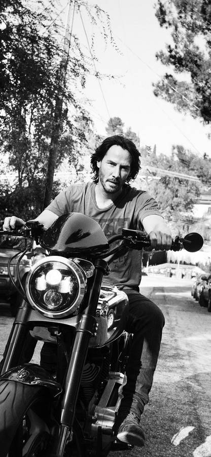 1125x2436 Keanu Reeves Bike Wallpaper Wallpaper