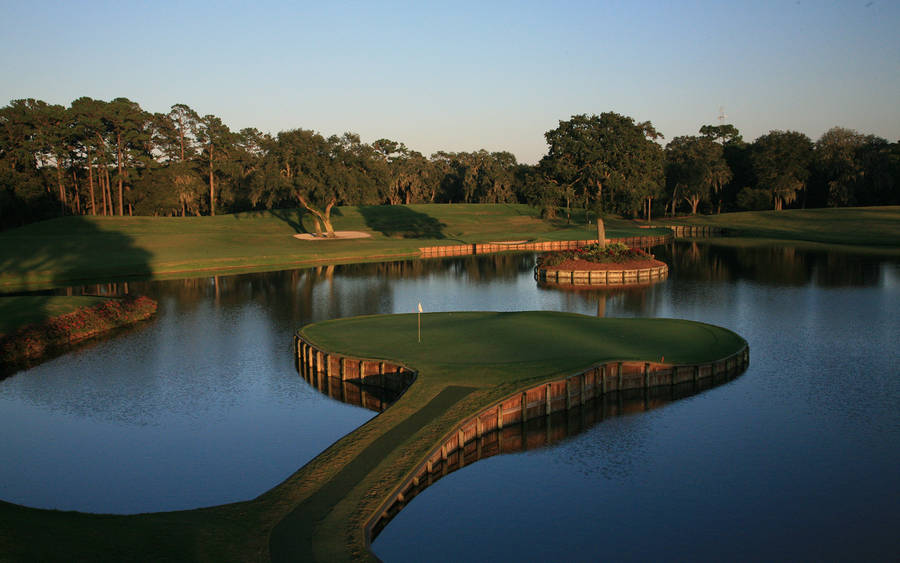 4k Golf Course Surrounded With Water Wallpaper