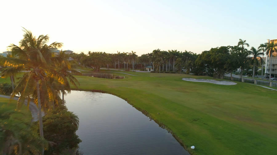 4k Golf Course With Pond Wallpaper