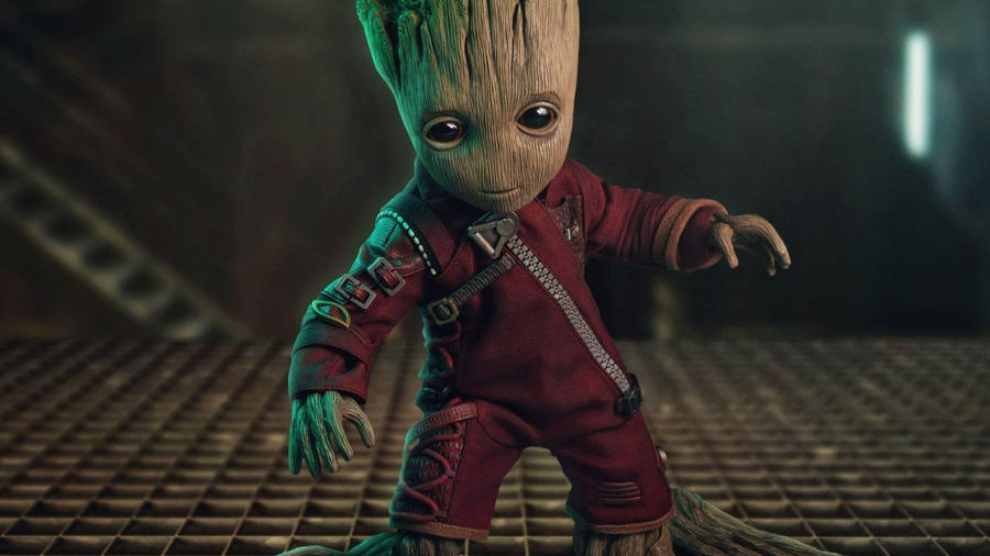 4k Guardians Of The Galaxy With Baby Groot In Red Suit Wallpaper