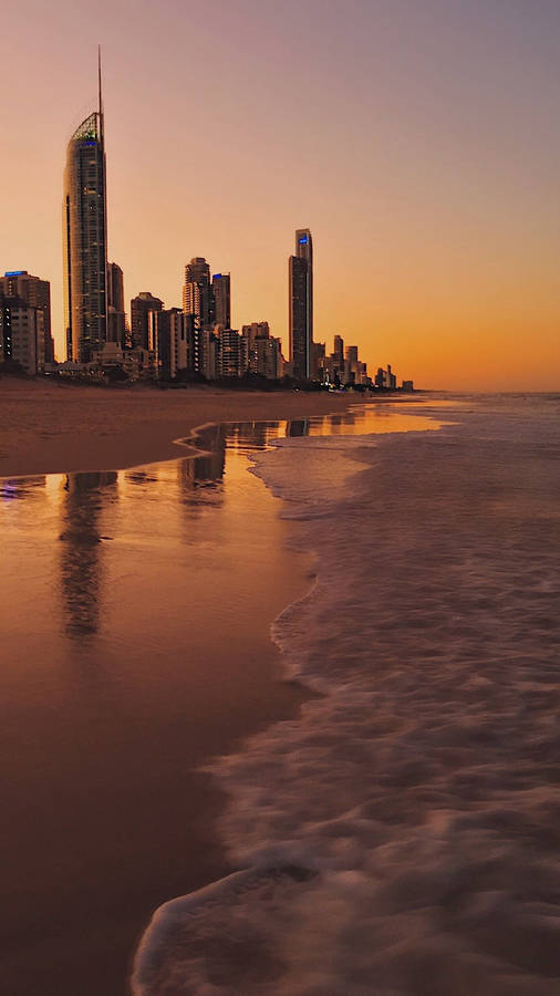 4k Iphone City During Sunset On Beach Wallpaper