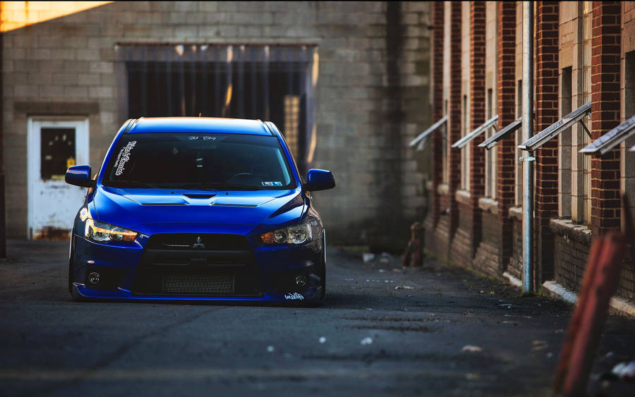 4k Jdm Mitsubishi Outside Brick Buildings Wallpaper