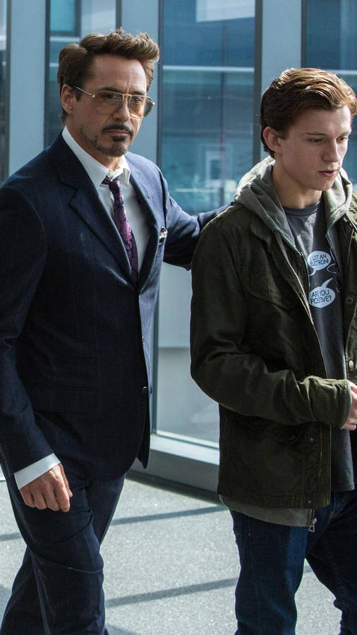 750x1334 Robert Downey Jr And Tom Holland In Spiderman Homecoming Wallpaper