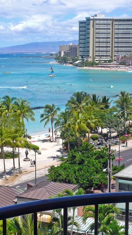 A Balcony Overlooking The Ocean And Beach Wallpaper