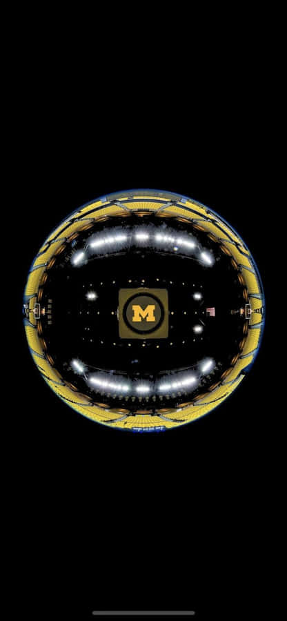 A Black And Gold Sphere With A Yellow Rim Wallpaper