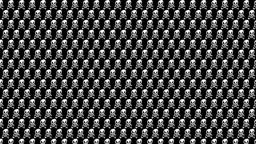A Black And White Pattern With Skulls On It Wallpaper