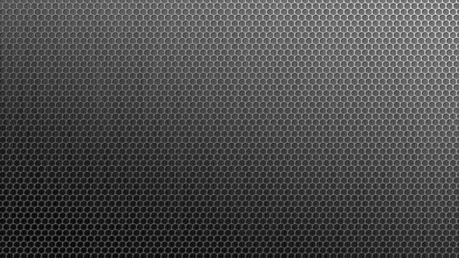 A Black Background With A Pattern Of Hexagons Wallpaper