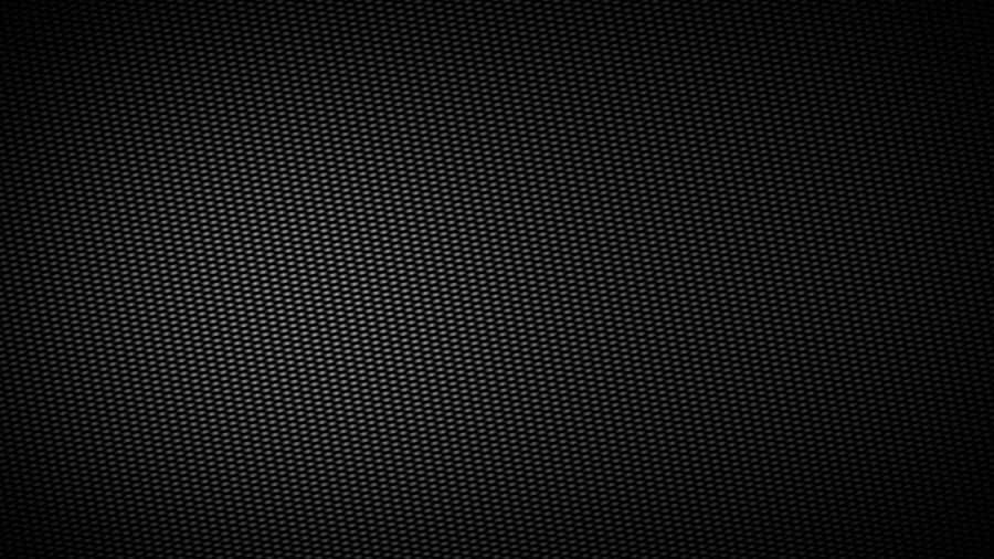 A Black Background With A Pattern Of Holes Wallpaper