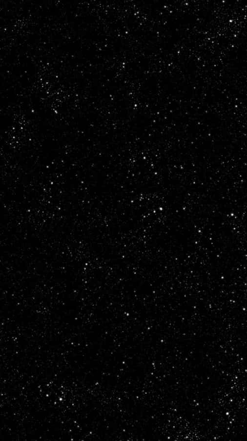 A Black Background With Stars On It Wallpaper