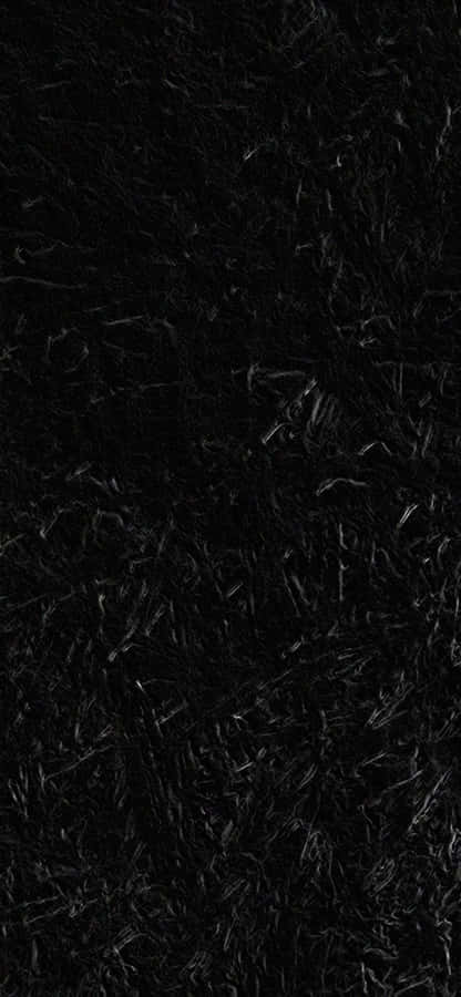 A Black Rug With A Black Background Wallpaper