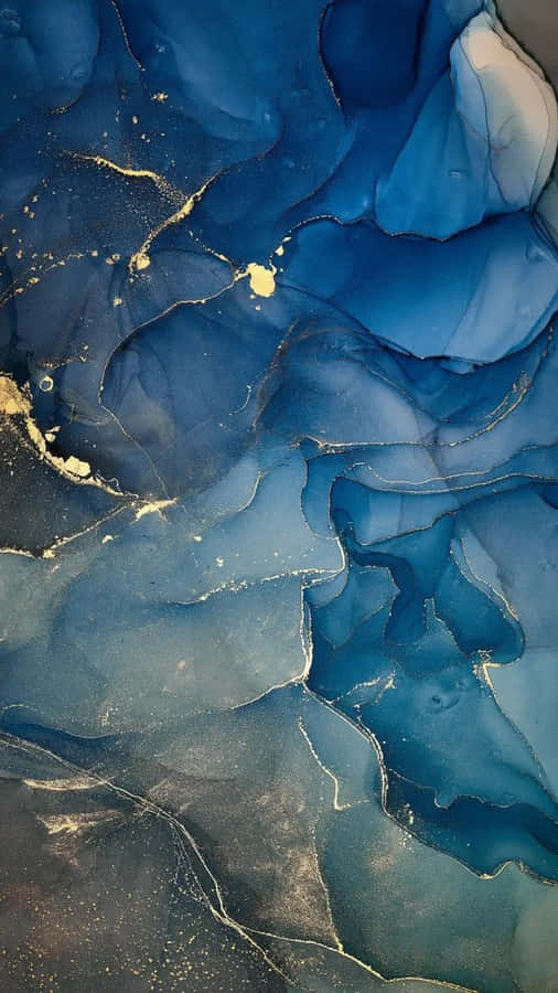 A Blue And Gold Liquid Is Floating In The Air Wallpaper