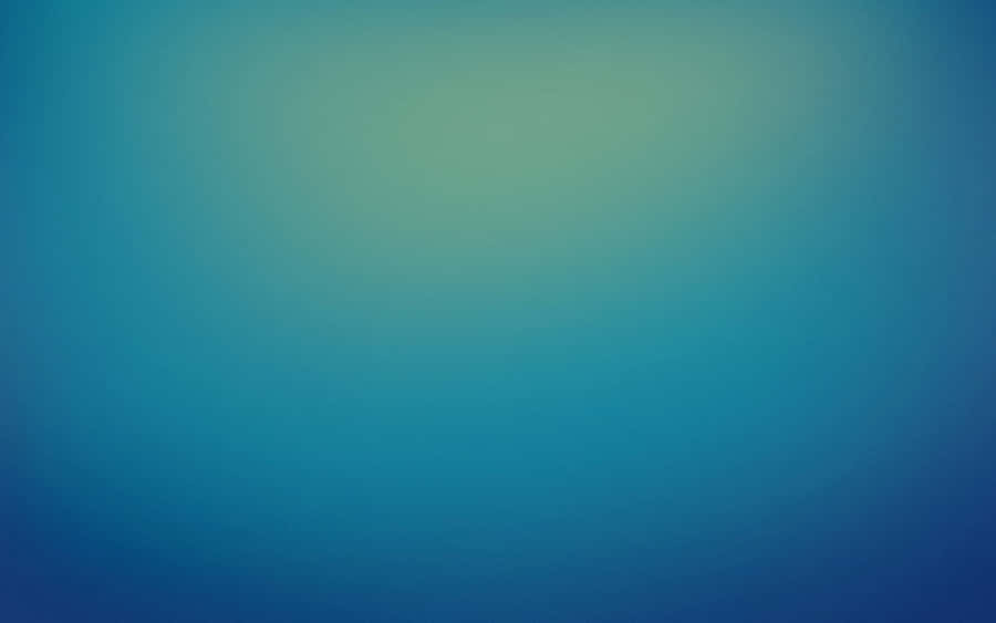 A Blue And Green Blurred Background Wallpaper