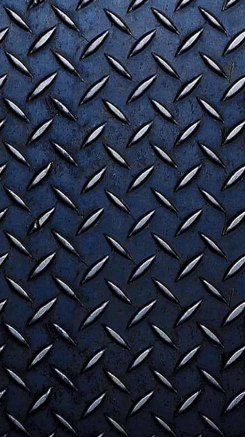 A Blue Metal Plate With Diamonds On It Wallpaper