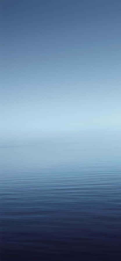 A Blue Ocean With A White Horizon Wallpaper