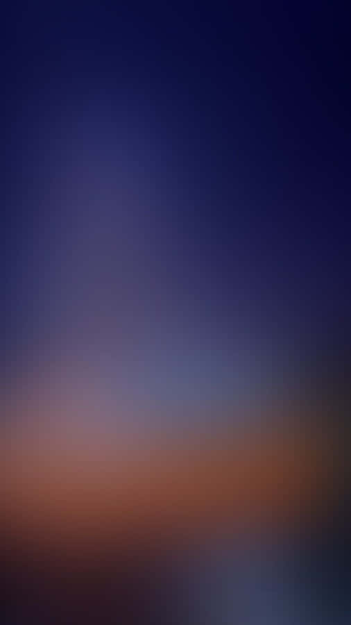 A Blurred Background With A Blue Sky And A Sunset Wallpaper