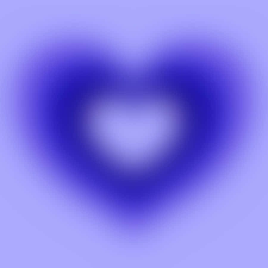 A Blurred Heart Shaped Image On A Purple Background Wallpaper