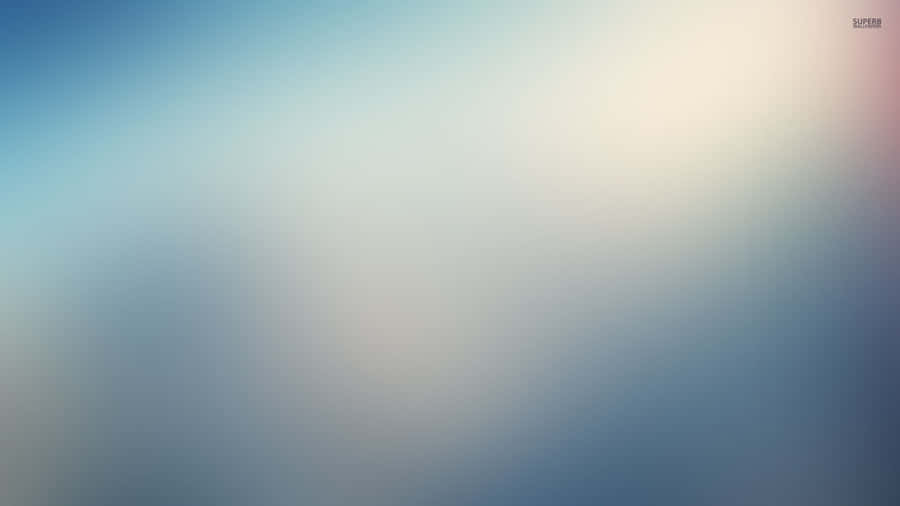 A Blurry Background With A Blue Sky Wallpaper