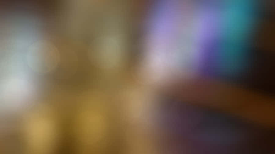 A Blurry Background With A Light Shining On It Wallpaper