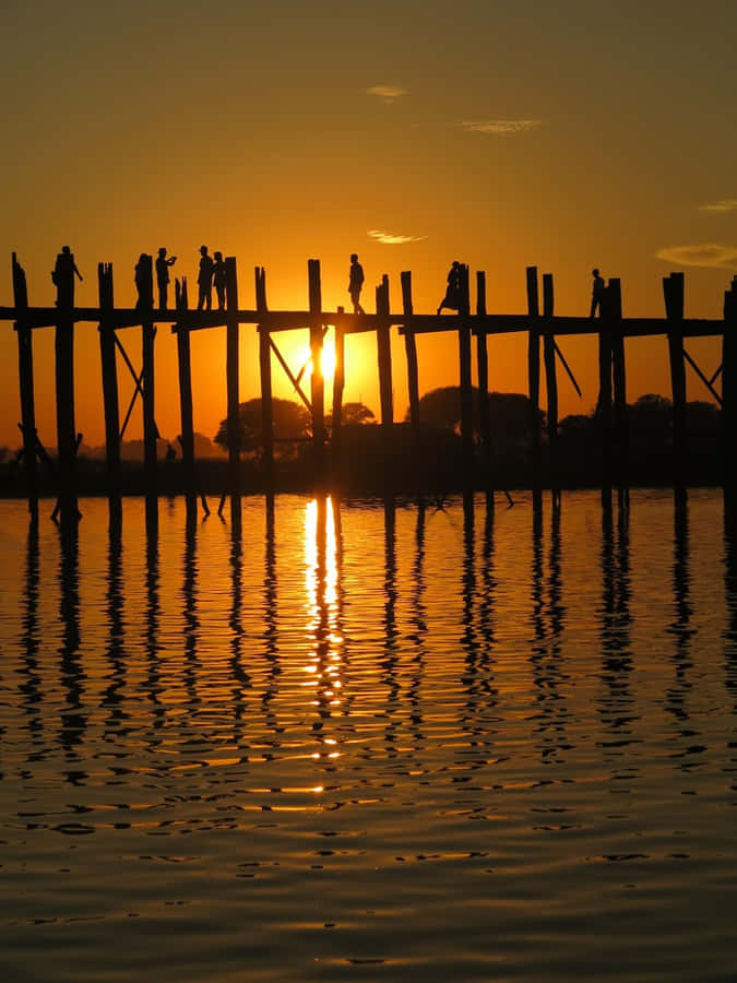 A Breathtaking Sunset Behind U Bein Bridge Near Mandalay Wallpaper