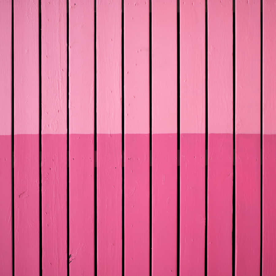 A Bright Pink Ipad Stands Out Against A White Background Wallpaper