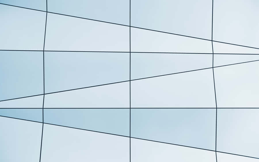 A Building With A Blue And White Glass Wall Wallpaper
