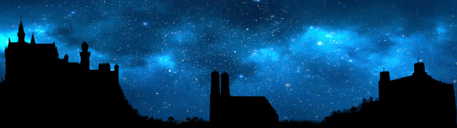 A City With A Blue Sky And Stars Wallpaper