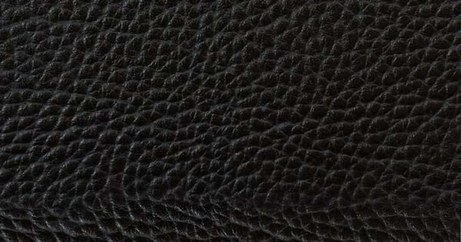 A Close Up Of A Black Leather Surface Wallpaper