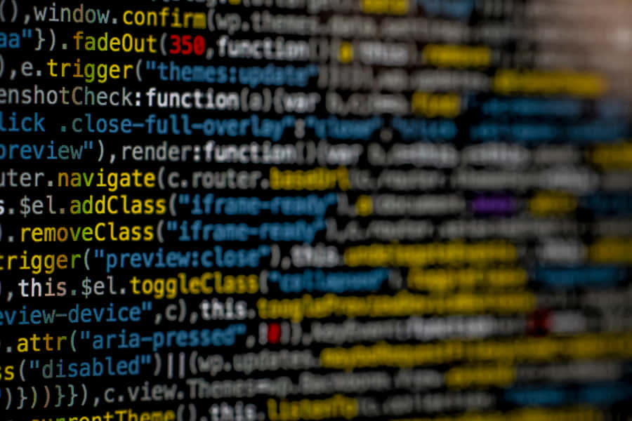 A Close Up Of A Computer Screen With A Lot Of Code Wallpaper