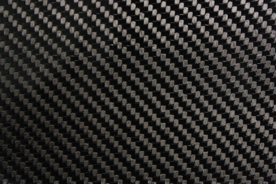 A Close Up Of Black And White Carbon Fiber Fabric Wallpaper