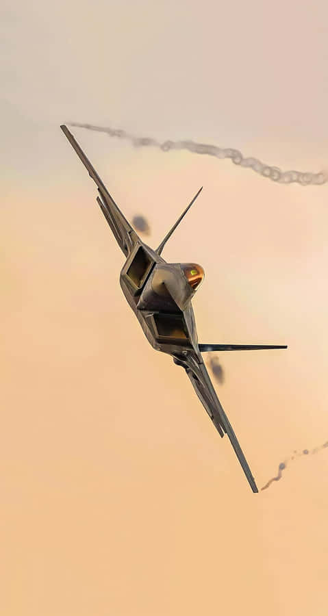 A Closeup Of An F-22 Raptor Jet In Flight Wallpaper