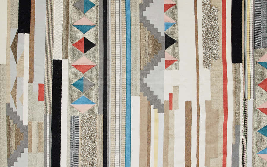 A Colorful Rug With Geometric Patterns Wallpaper