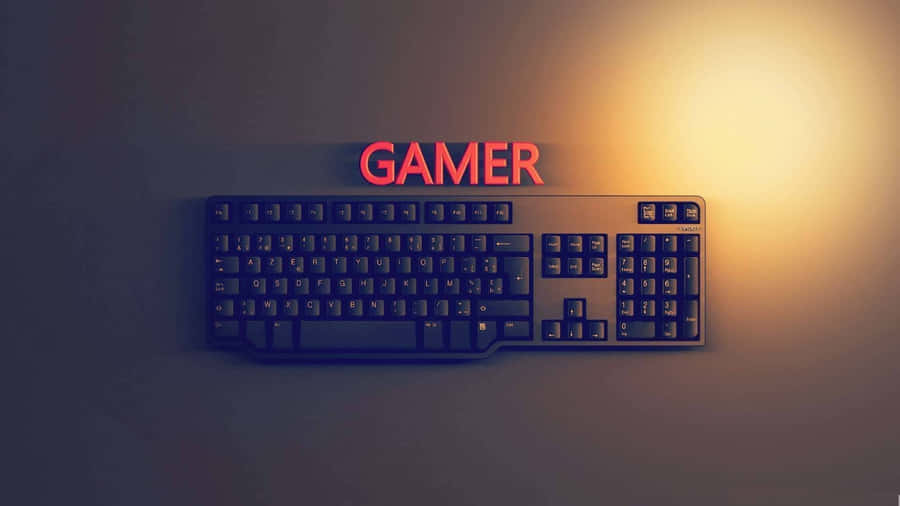 A Computer Keyboard With The Word Gamer On It Wallpaper