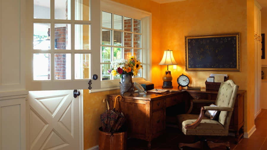 A Desk In A Room With A Door Wallpaper