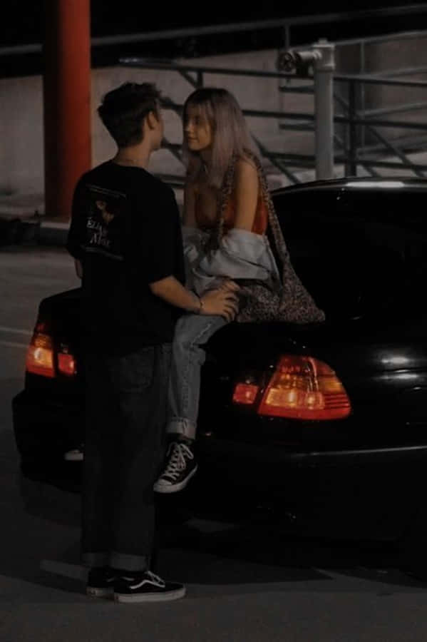 A Girlfriend And Boyfriend Spending Time Together In A Meadow On A Beautiful Day. Wallpaper