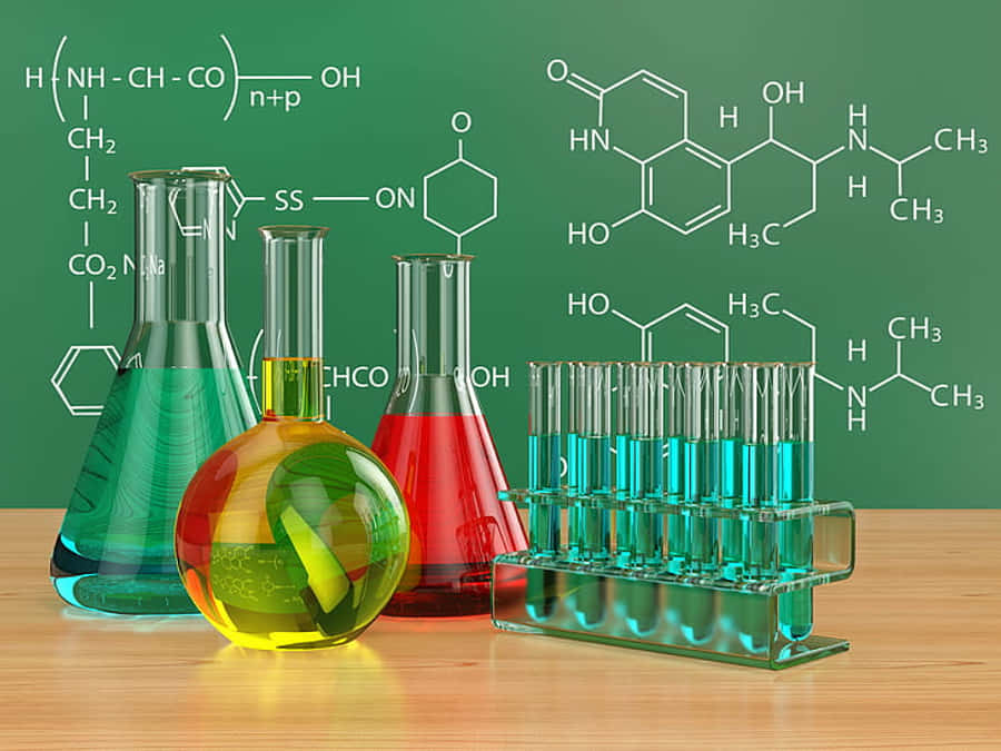 A Group Of Laboratory Flasks And A Chalkboard Wallpaper