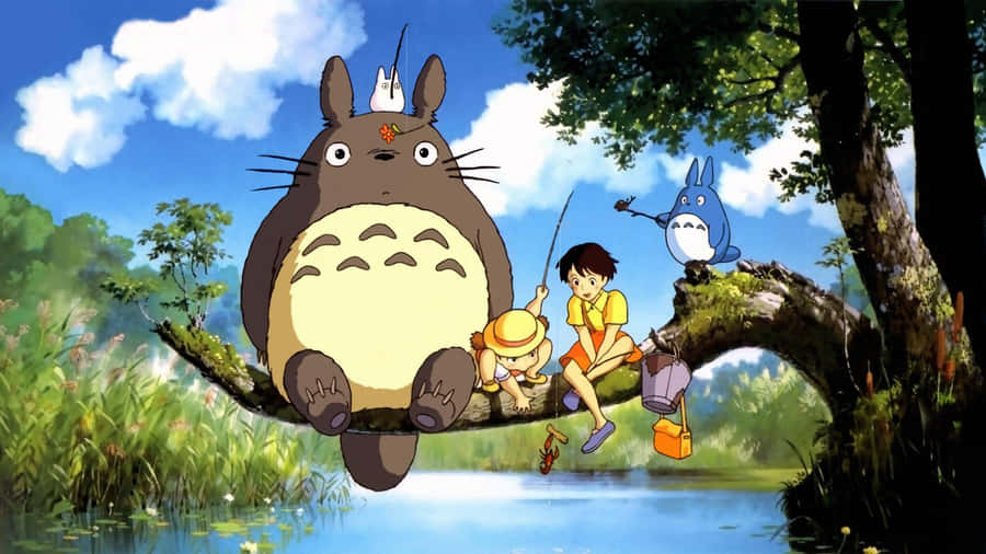 A Group Of Totoro Characters Sitting On A Tree Branch Wallpaper