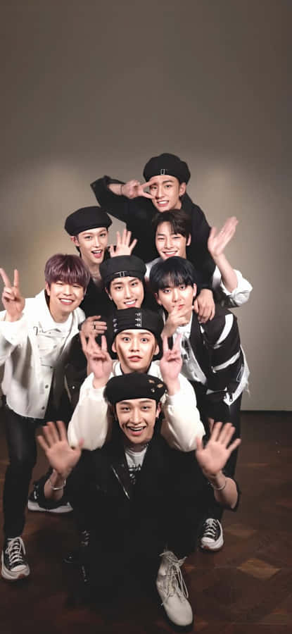 A Group Of Young Men Posing For A Photo Wallpaper