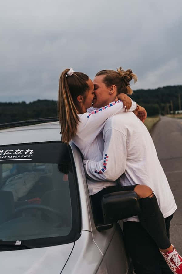 A Happy Couple Enjoying A Lovely Day Outdoors. Wallpaper
