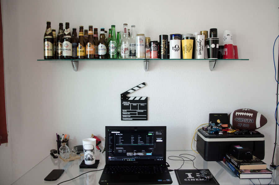 A Laptop Computer On A Shelf Wallpaper