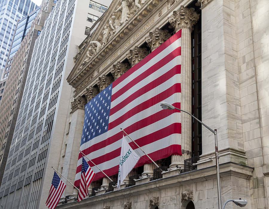 A Large American Flag Is On The Wall Of The New York Stock Exchange Wallpaper