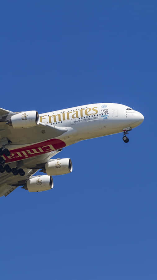 A Large Jet Flying Through The Sky Wallpaper