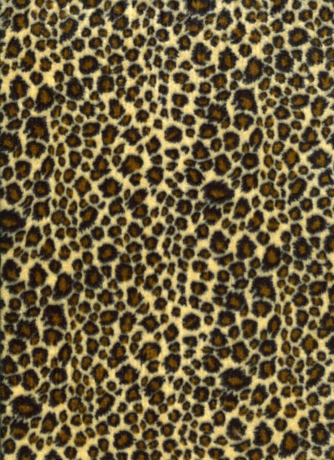 A Leopard Print Fabric With Black Spots Wallpaper