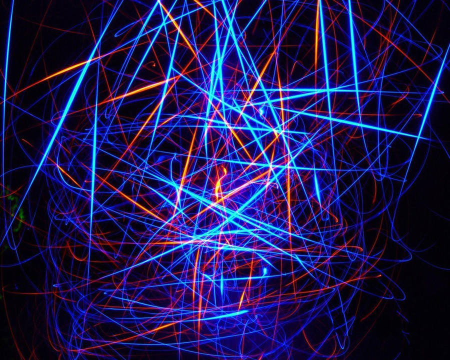 A Light Painting Of Blue And Orange Lines Wallpaper
