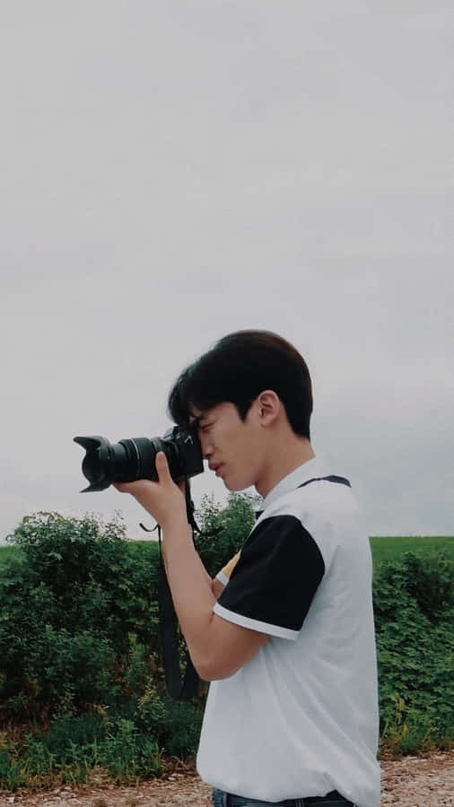 A Loving Couple Enjoying Their Time Together Outdoors Wallpaper