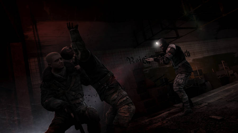 A Man Is Holding A Gun In A Dark Room Wallpaper