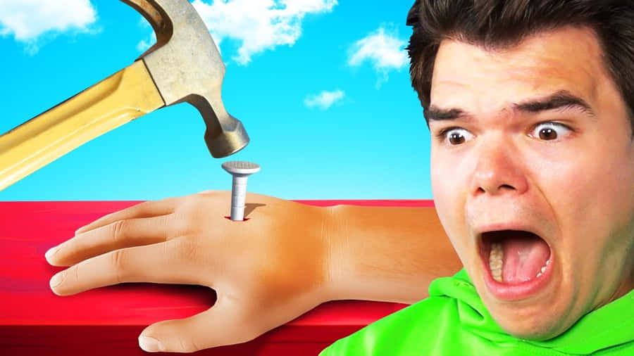 A Man Is Holding A Hammer And A Hammer Wallpaper