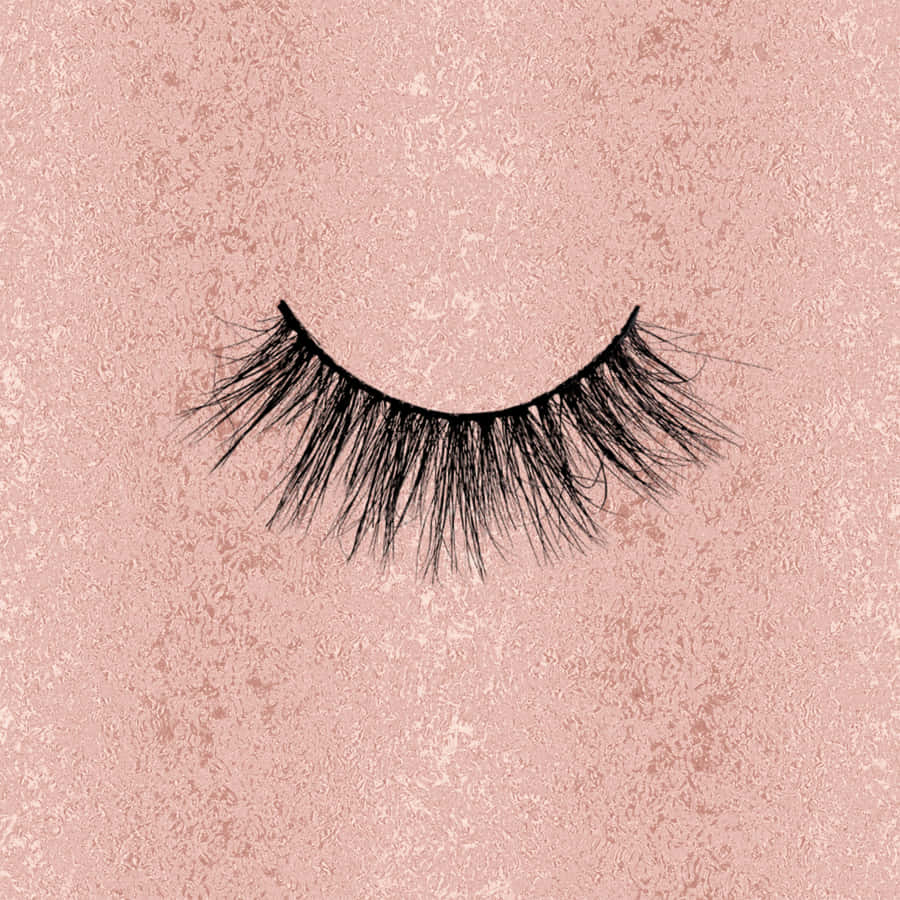 A Pair Of False Eyelashes On A Pink Background Wallpaper