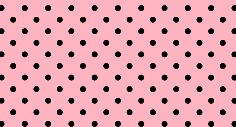 A Pink Background With Black Dots Wallpaper